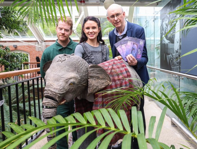 Pictured at the launch of the 2024 Belfast International Arts Festival programme are musician Ciaran Lavery (left) and festival chief executive and artistic director Richard Wakely with Phillipa O'Hara (centre) and baby elephant Janu from the upcoming production of The Vanishing Elephant by Cahoots at The Grand Opera House.