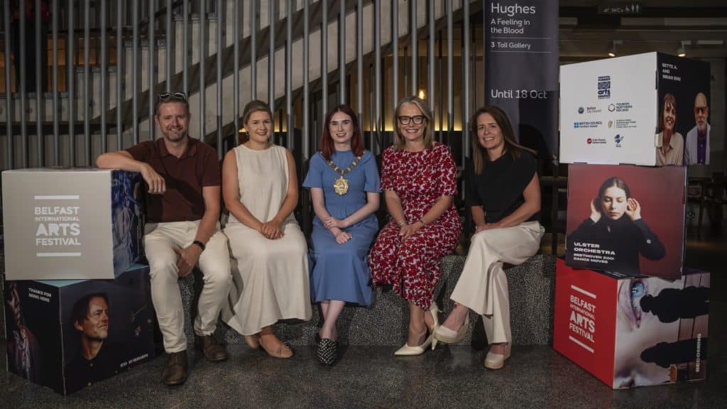 Seated in a row are Chris McCreery (BIAF Artistic Director), Sharon Doherty (BIAF Board member), Lord Mayor of Belfast Róis-Maire Donnelly, Laura McCorry MBE (Tourism NI CEO) and Nora Douds (Arts Council NI Chair).