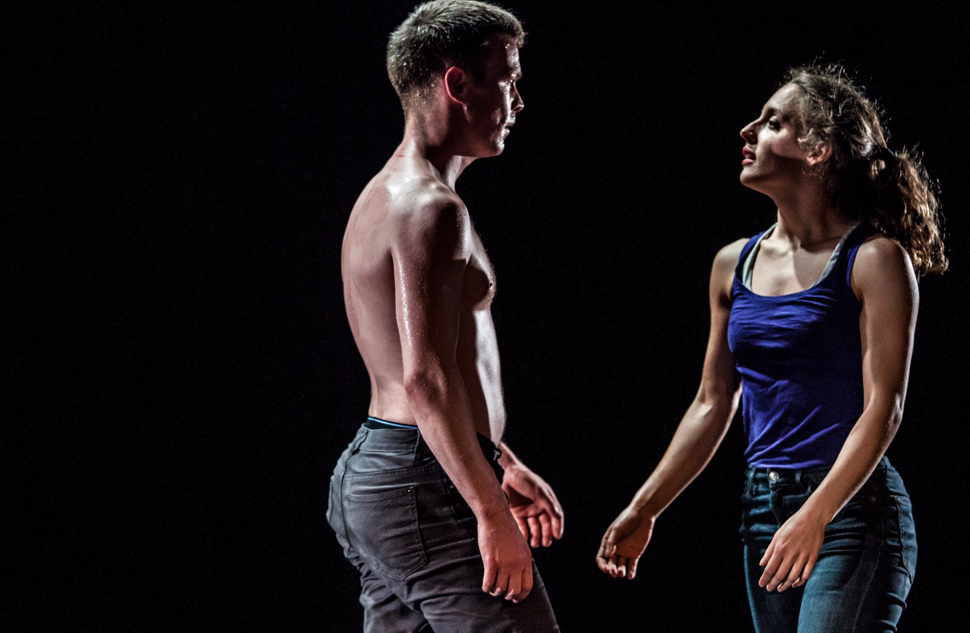 A male and female dancer walk towards each other. From Cuck, 2017, which was produced by Tinderbox. Photo Credit Ciaran Bagnall